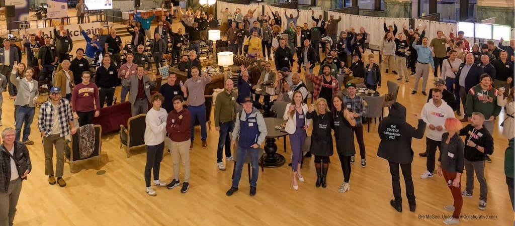 MNblockchain community members celebrating at a flagship event